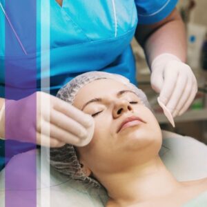 beautician using cotton pads to apply a product to a client's face
