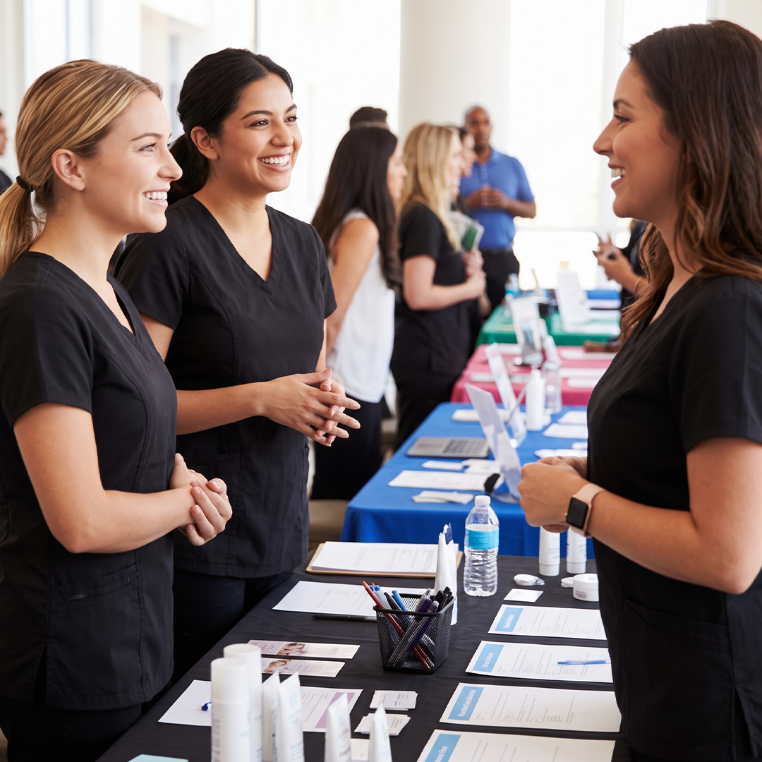 Students and industry professionals connect and network at an esthetics career fair.
